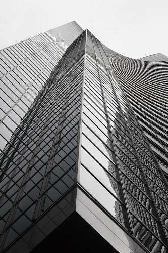 high rise grey curtain building during daytime black-and-white